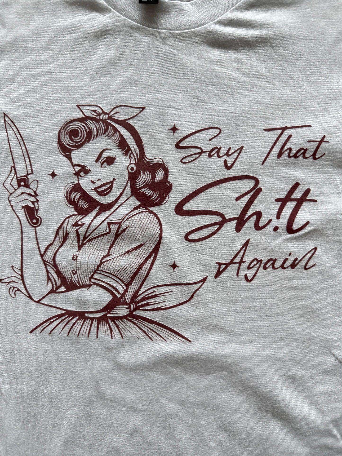 Introducing our bold and humorous T-shirt: "SAY THAT SHIT AGAIN"