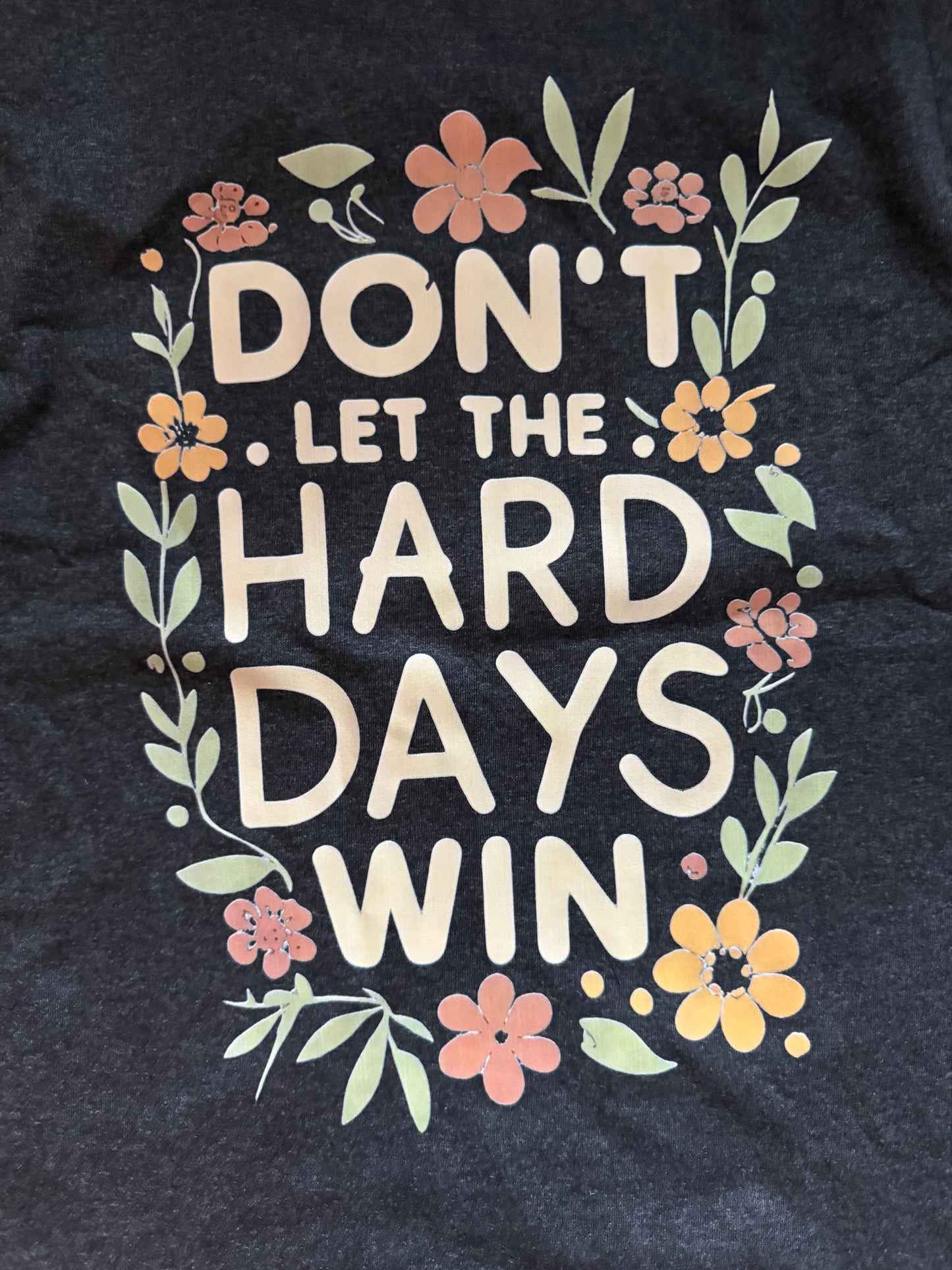 "NEVER LET THE HARD DAYS WIN" T-SHIRT